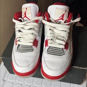 Air Jordan 4 White and Red Sneakers